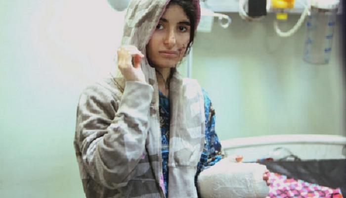 فتاة فارة من أحياء الموصل