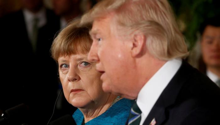 المستشارة الألمانية ميركل والرئيس الأمريكي ترامب- (رويترز)