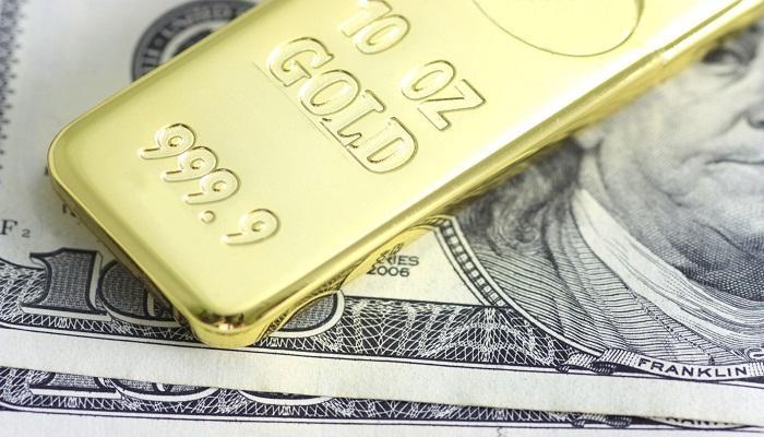 الذهب يتراجع أمام الدولار