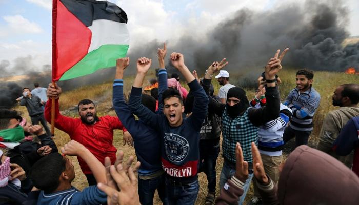 مسيرات فلسطينية لإحياء ذكرى يوم الأرض - رويترز