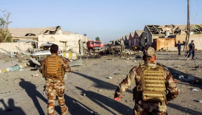 قوات الأمن العراقية تصل مكان الانفجار (أ ف ب)
