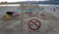 هندي ينفذ مجسما رمليا للتوعية بإنفلونزا الخنازير
