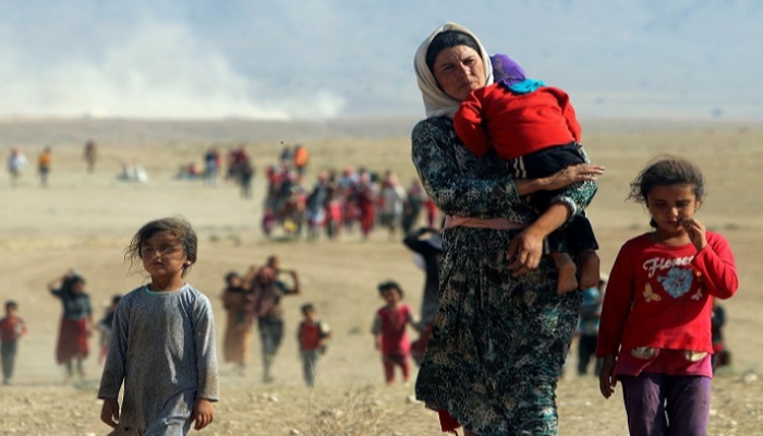 صورة أرشيفية لنازحين من الأيزيديين في العراق (رويترز)