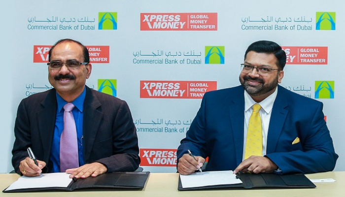 توقيع الاتفاقية بين دبي التجاري وشركة إكسبرس