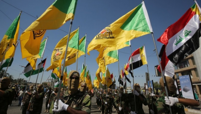 عناصر تابعة لكتائب حزب الله العراق تستعرض قواتها - أرشيفية