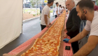 بيتزا طولها 103 أمتار.. مطعم يجمع المال لرجال الإطفاء بأستراليا