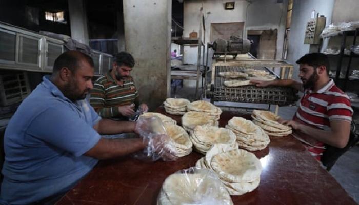 عملات نقدية تحمل صورة الرئيس السوري بشار الأسد