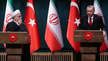الرئيس التركي رجب طيب أردوغان ونظيره الإيراني حسن روحاني (رويترز)