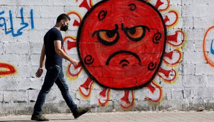 جدارية بغزة تحذر من مخاطر كورونا