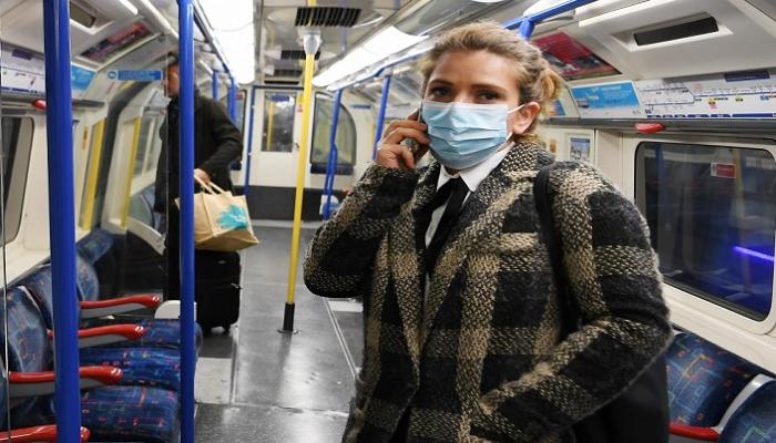 سيدة ترتدي كمامة للوقاية من عدوى كورونا - أرشيفية