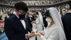 الحب يتحدى كورونا.. زفاف جماعي بالكمامات في كوريا الجنوبية