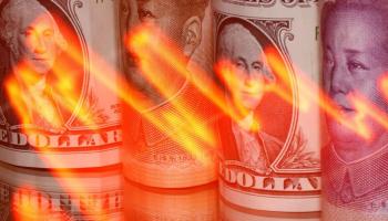 عملات ورقية لليوان والدولار - رويترز