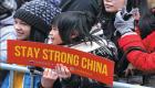 الصينيون يكافحون كورونا داخل بلادهم.. والتمييز والكراهية في الغربة