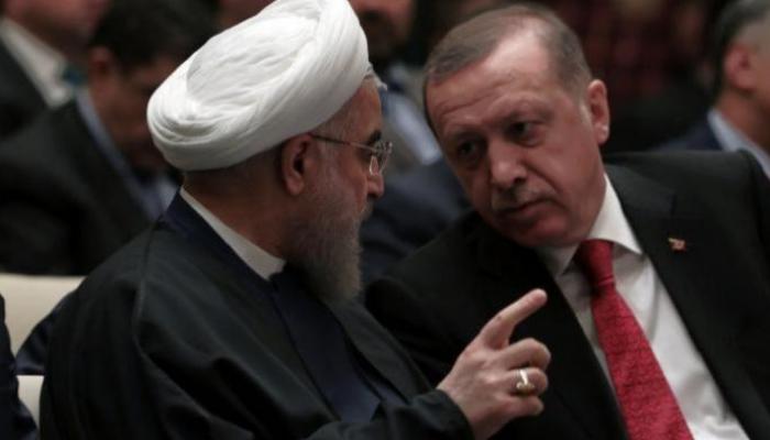 الرئيس التركي رجب أردوغان ونظيره الإيراني حسن روحاني