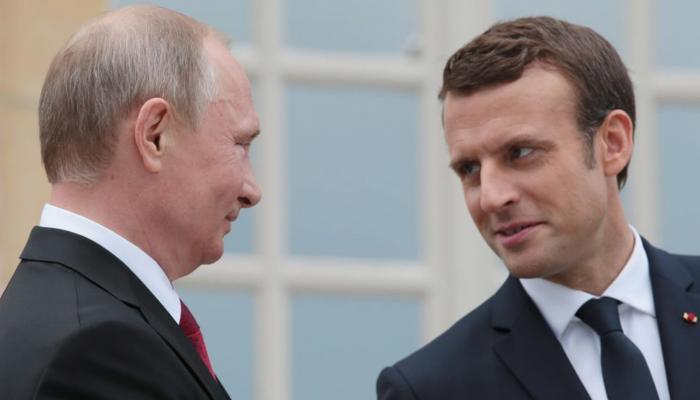  الرئيس الروسي فلاديمير بوتين ونظيره الفرنسي إيمانويل ماكرون