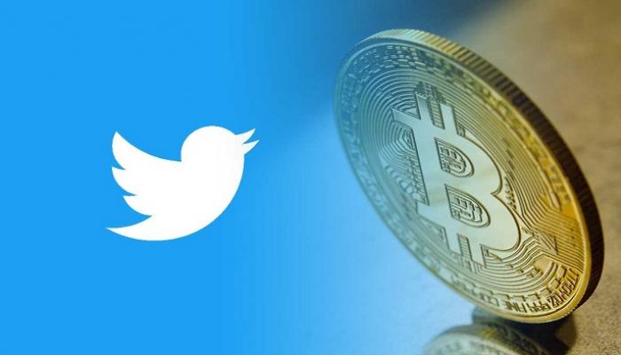 شعار تويتر مع عملة بيتكوين