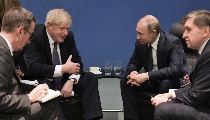 الرئيس الروسي ورئيس وزراء بريطانيا في لقاء سابق