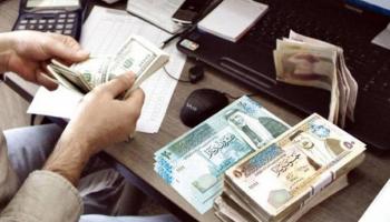 نقص عملة الدينار بمكاتب الصرافة في غزة
