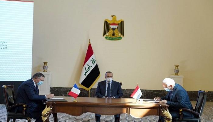 جانب من توقيع اتفاقيات المشاريع بين العراق وتوتال
