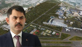 وزير البيئة والتحول العمراني التركي وفي خلفيته المطار