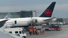 آتش‌سوزی یک خودرو زیر هواپیما در فرودگاه مونترال کانادا (+ویدئو)