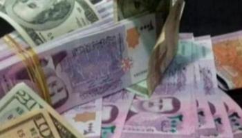 ليرة سورية و دولار أمريكي - أرشيفية 