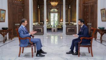 الرئيس السوري بشار الأسد مع محاوره من 
