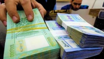 الليرة اللبنانية  والدولار الأمريكي - أرشيفية 