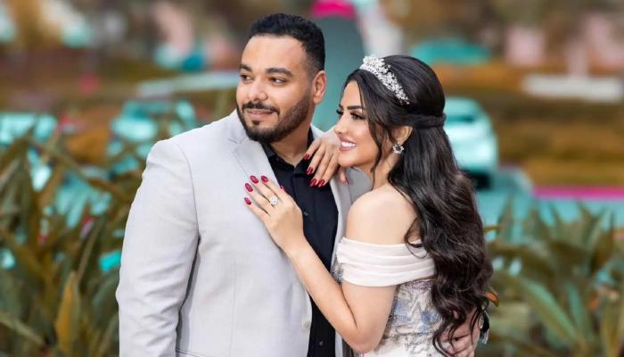 إيمان عبدالغني وزوجها حسام رمضان
