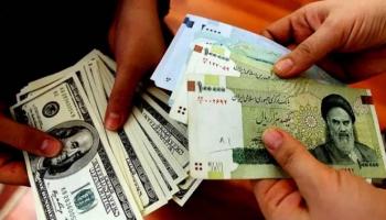 الريال الإيراني والدولار الأمريكي - أرشيفية