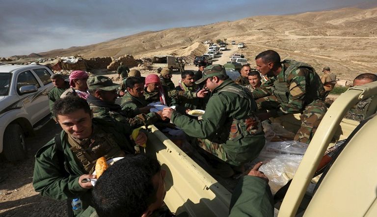 القوات الكردية لحظة دخولها سنجار شمالي العراق
