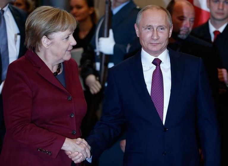 هولاند وميركل