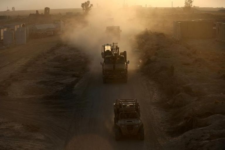 أفراد من قوات الحشد الشعبي العراقية (رويترز)