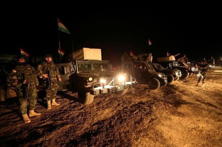 أفراد من قوات الحشد الشعبي العراقية (رويترز)