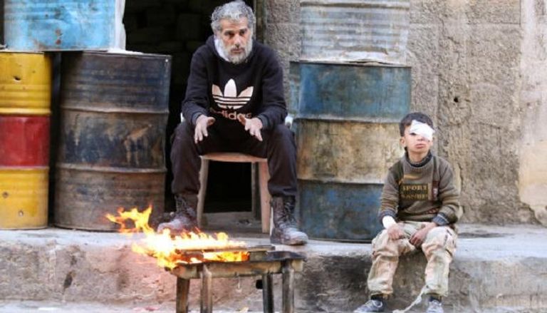 طفل ووالده في حلب