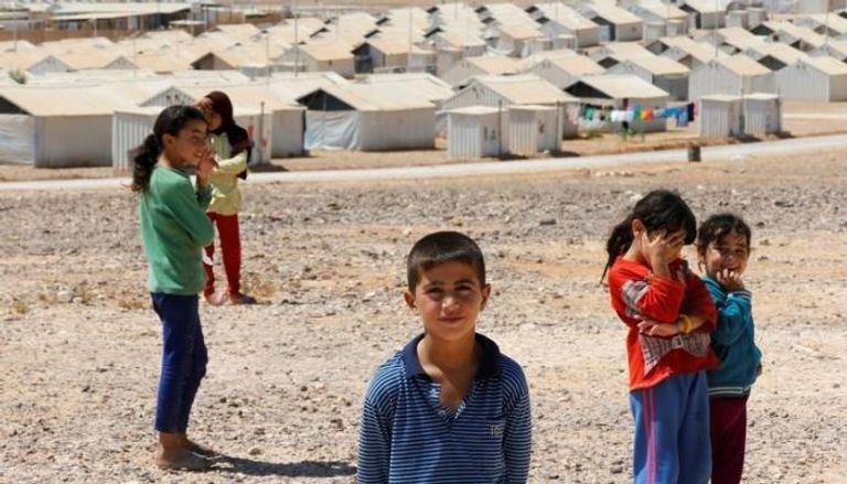 أطفال سوريون في مخيم للاجئين