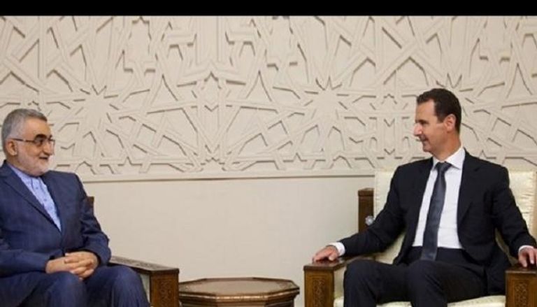 الأسد خلال لقائه برئيس لجنة الامن القومي الإيراني