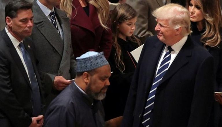 الإمام ماجد والرئيس الأمريكي ترامب - رويترز