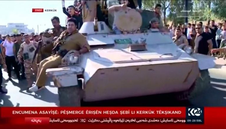 قوات كردية في شوارع كركوك - رويترز