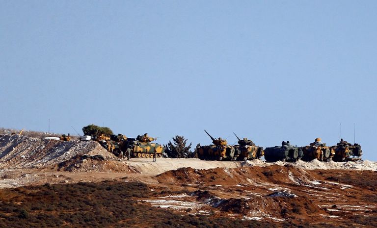 العلم التركي فى عفرين - رويترز