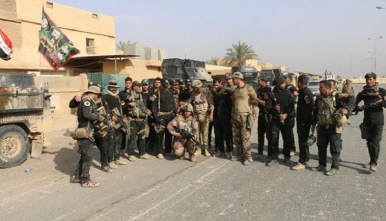 القوات العراقية ومليشيا الحشد الشعبي في المدينة