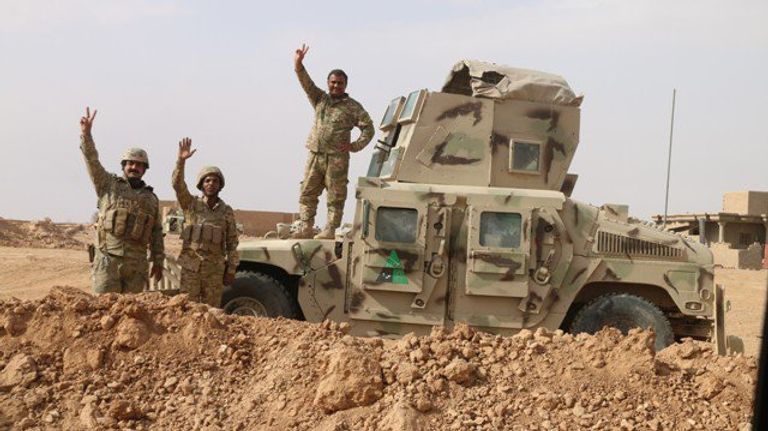 القوات العراقية ومليشيا الحشد الشعبي في المدينة