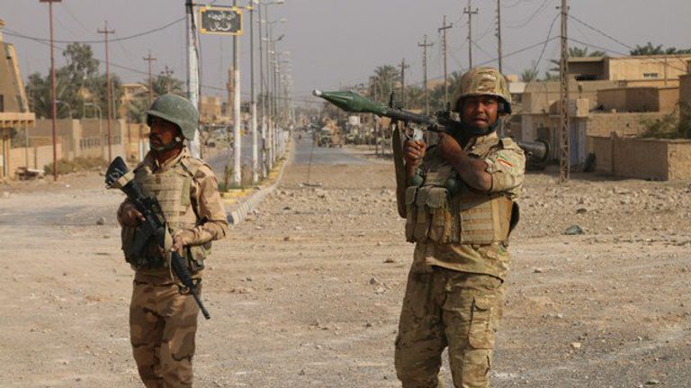 القوات العراقية ومليشيا الحشد الشعبي في المدينة
