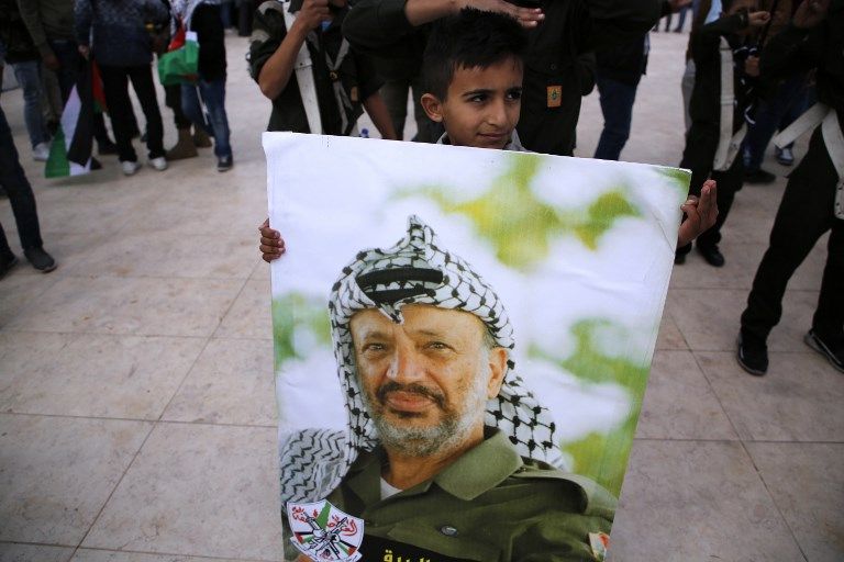 إحياء ذكرى رحيل عرفات بالضفة الغربية (أ.ف.ب)