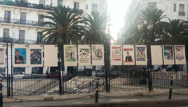 صور المرشحين في الانتخابات المحلية تنتشر بشوارع الجزائر