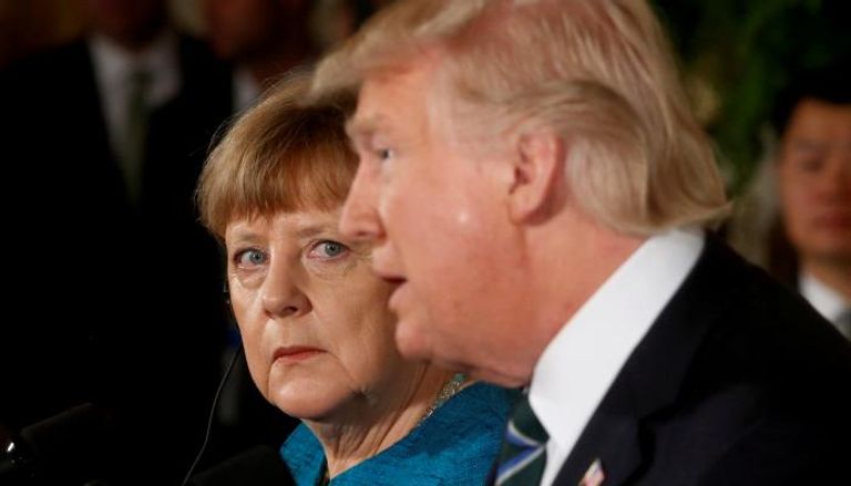 المستشارة الألمانية ميركل والرئيس الأمريكي ترامب- (رويترز)
