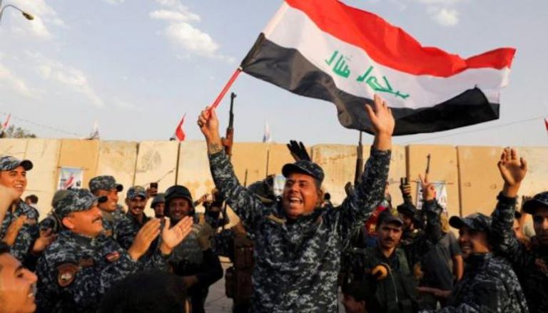 سعادة الجنود بعد الانتصار على داعش في غرب الموصل - أرشيفية 