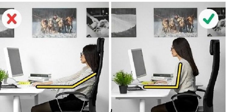 الجلوس في العمل بشكل خاطئ يسبب الآلام