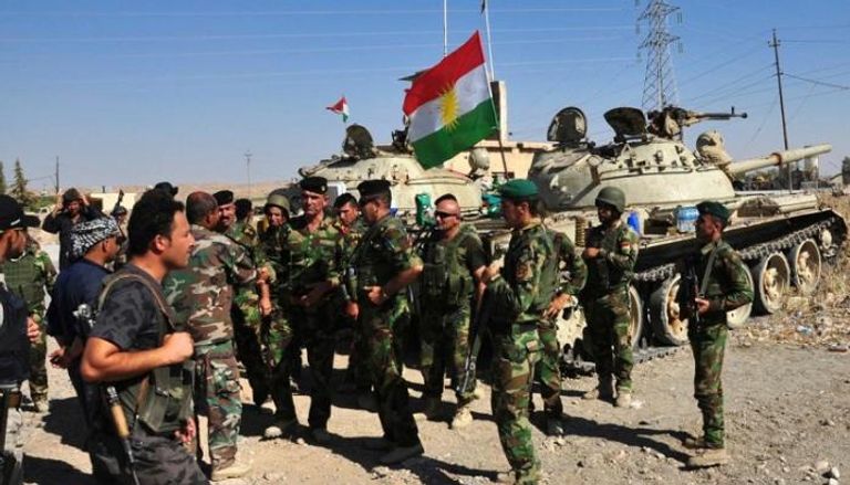 قوات البيشمركة في بعشيقة التي تشهد توترات بين الكرد وميليشا الحشد ميلييا الحشد الشعبي قرب الموصل (الفرنسية)