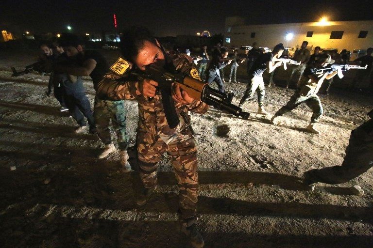 فرقة أبو العباس التابعة للحشد الشعبي الموالي لإيران بالبصرة القوات العراقية قرب البصرة (الفرنسية)